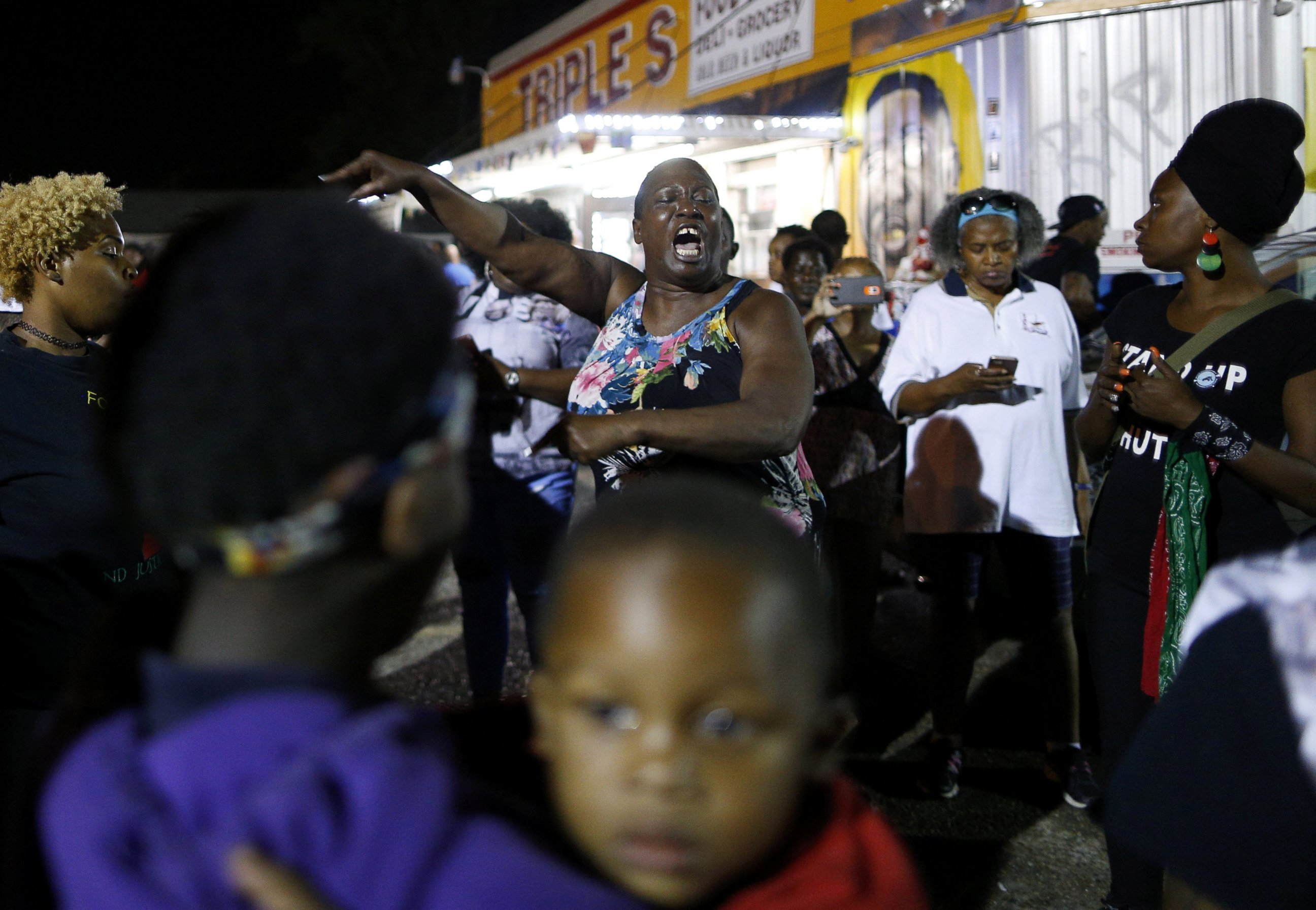 PHOTO: Alton Sterling's aunt Veda Washington-Abusaleh speaks to community members during a vigil at the Triple S Food Mart, in Baton Rouge, Louisiana, on May 2, 2017.