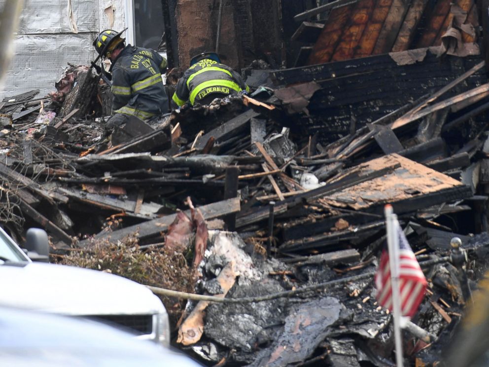 PHOTO: Officials at the scene of a overnight house fire where several children were presumed dead and others including the mother injured in Baltimore, Jan. 12, 2017.