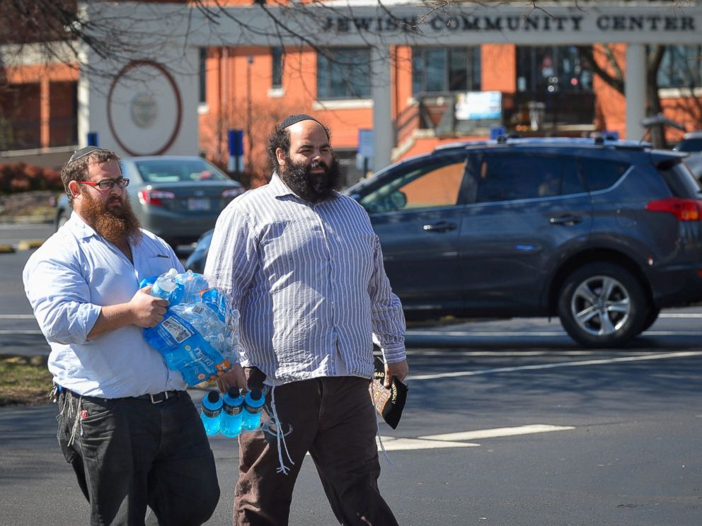 PHOTO: Rabbis with the local community share water with first responders as local and federal officers respond to the bomb threat at the Jewish Community Center in Louisville, Ky., March 8, 2017.
