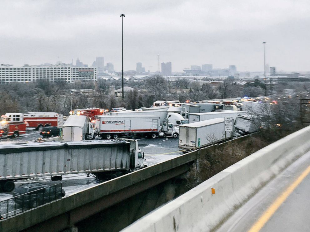 PHOTO: Trucks and vehicles are shown in a pile-up involving a fuel tanker that skidded off the 1-95 highway in Baltimore, Maryland, Dec. 17, 2016.