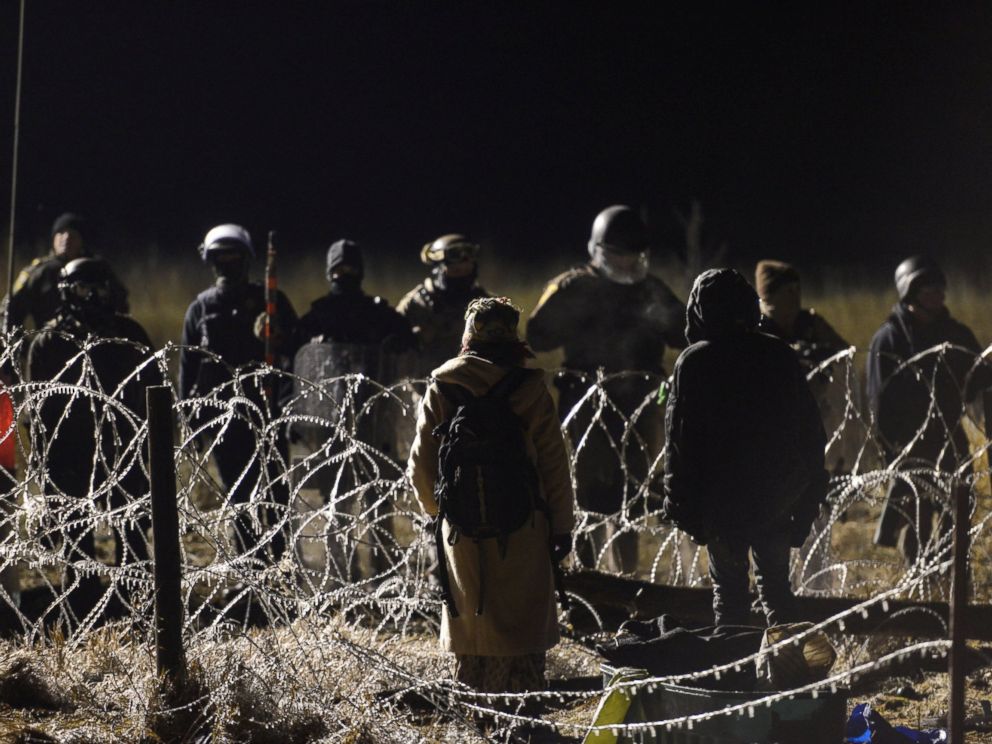 PHOTO: Protesters stand off with police during a protest against plans to pass the Dakota Access pipeline near the Standing Rock Indian Reservation, North Dakota, Nov. 20, 2016.