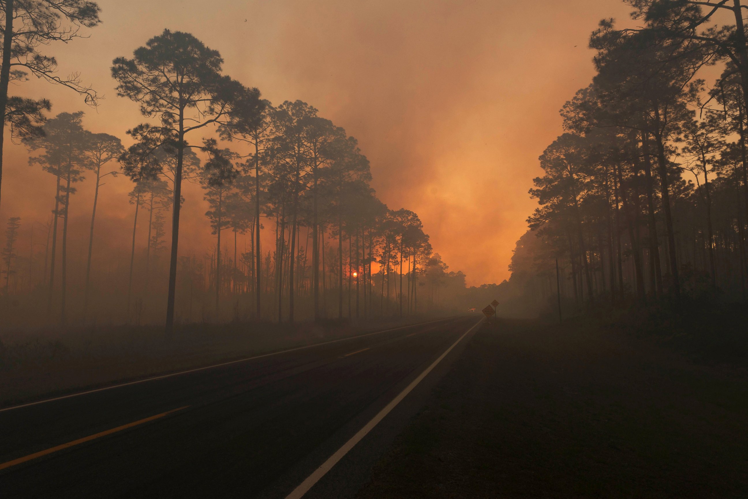 PHOTO: Smoke is seen during sunset as the West Mims fire burns in the Okefenokee National Wildlife Refuge in Georgia, in a photo released April 29, 2017. 