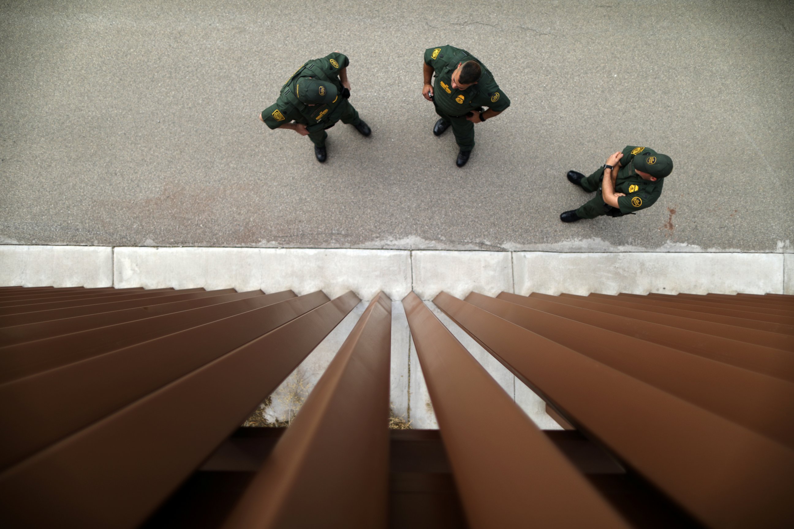 PHOTO: Border patrol agents stand next to a border fence used for training at the United States Border Patrol Academy in Artesia, New Mexico, June 8, 2017.
