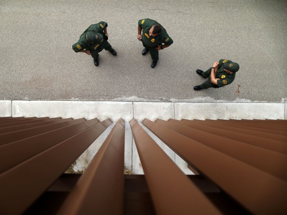 PHOTO: Border patrol agents stand next to a border fence used for training at the United States Border Patrol Academy in Artesia, New Mexico, June 8, 2017.