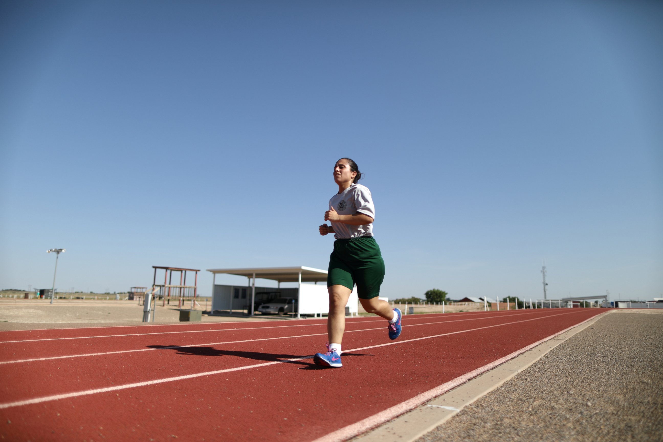PHOTO: Border patrol trainee Stevany Shakare, from Iraq, runs during physical training class at the United States Border Patrol Academy in Artesia, New Mexico, June 9, 2017. 