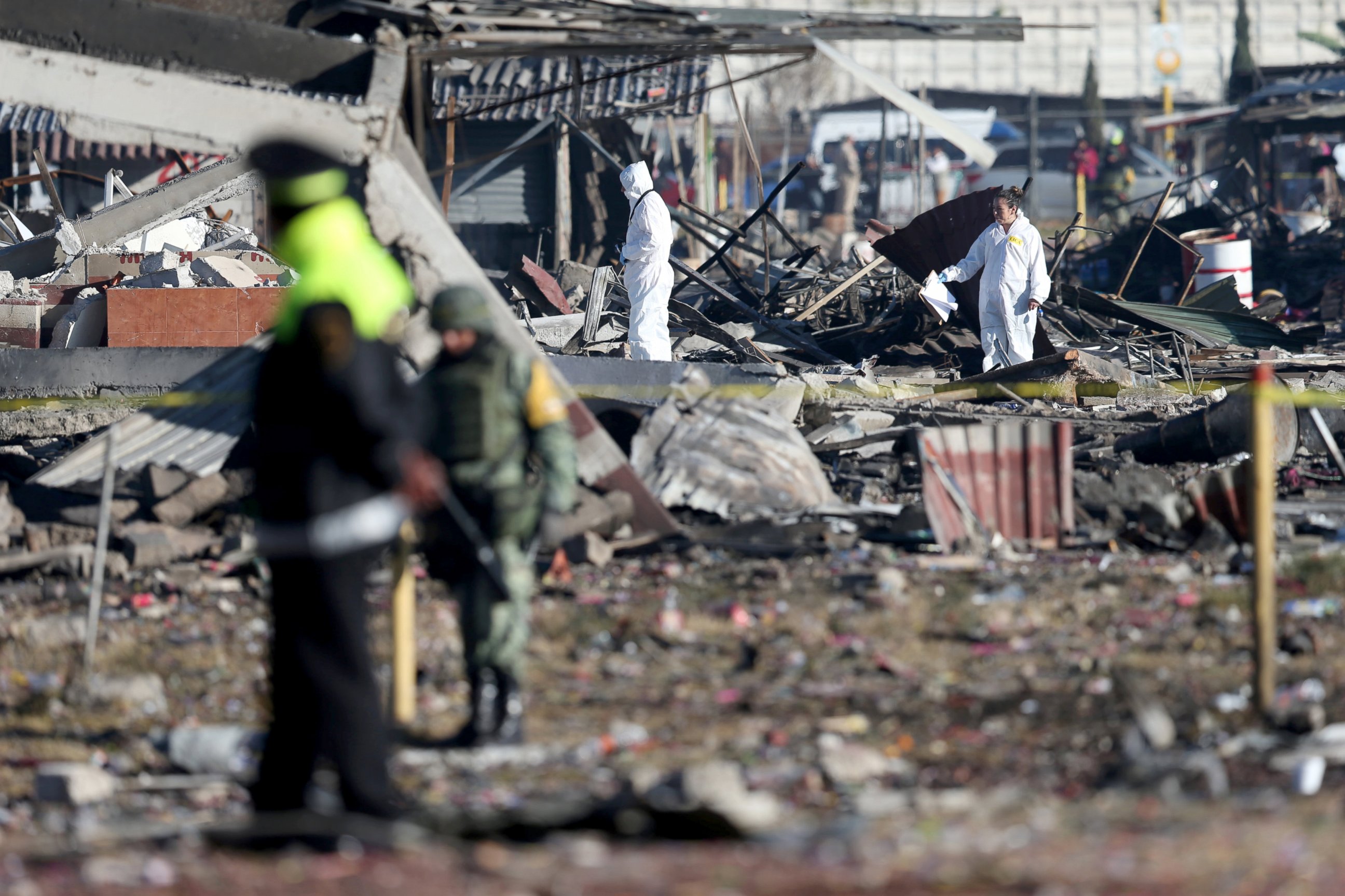 PHOTO: Investigators work amidst the wreckage of houses destroyed in an explosion at the San Pablito fireworks market outside the Mexican capital in Tultepec, Mexico Dec. 21, 2016. 
