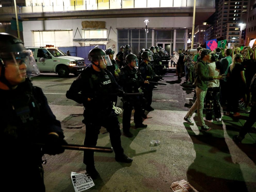 PHOTO: Demonstrators are blocked by an LAPD skirmish line during a march through the streets of downtown Los Angeles in protest in Los Angeles, Nov. 11, 2016.
