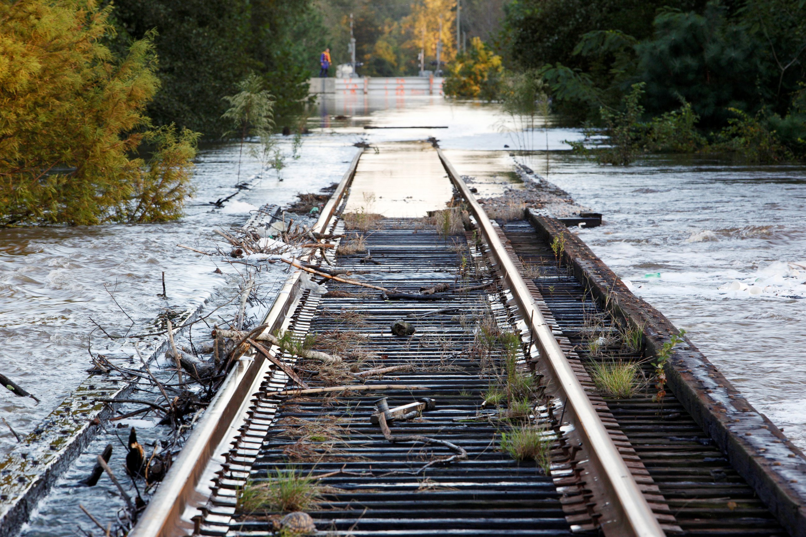 PHOTO: Debris swept downriver by the rising Tar River litter a flooded rail bridge crossing the river from Tarboro into Princeville as the river crests in the aftermath of Hurricane Matthew, in Tarboro, North Carolina, on Oct. 13, 2016. 