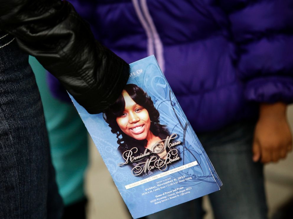 PHOTO: A mourner holds an obituary displaying a picture of shooting victim Renisha McBride during her funeral service in Detroit, Mich., Nov. 8, 2013.
