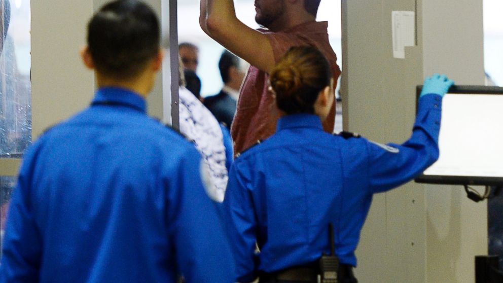 An airline passenger stands in a full-body scanner at Transportation Security Administration checkpoint at Los Angeles International Airport, Calif. in this Feb. 20, 2014 file photo. 