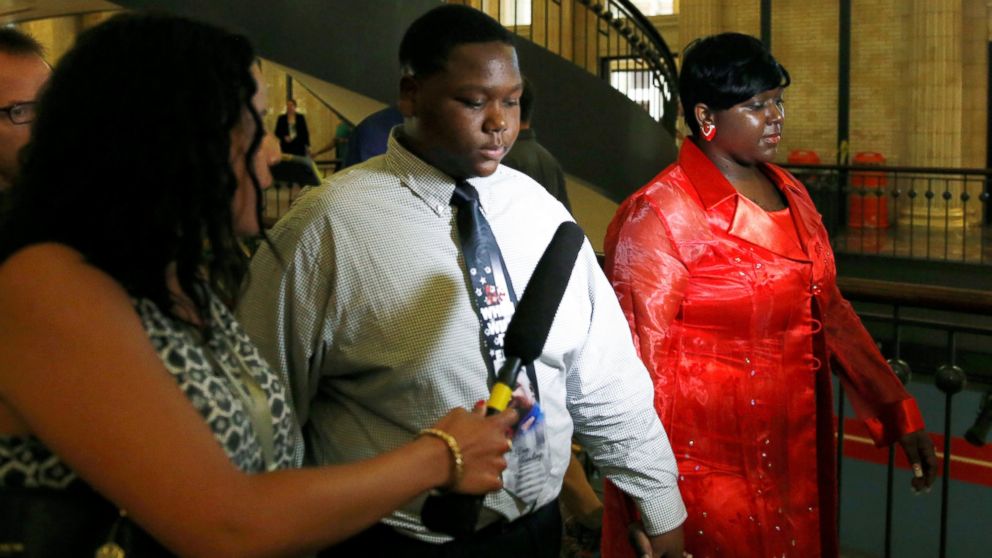 Cameron Sterling, son of Alton Sterling who was killed by police in Baton Rouge, Louisiana, arrives with his mother Quinyetta McMillan, right, at Union Station in Washington, July 14, 2016.  