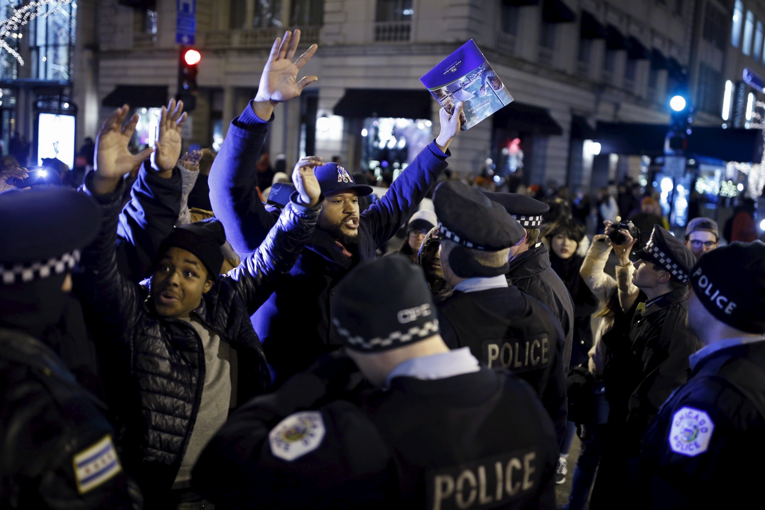 PHOTO: Demonstrators confront police officers during a protest in reaction to the fatal shooting of Laquan McDonald in Chicago, Nov. 27, 2015. Laquan McDonald, 17, was fatally shot by Jason Van Dyke, a Chicago police officer, in October 2014. 