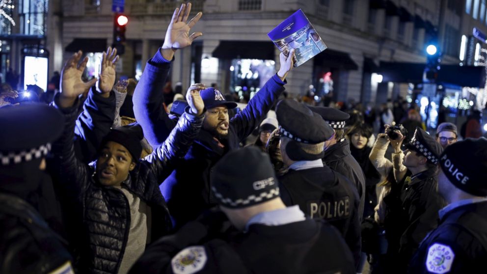 Demonstrators confront police officers during a protest in reaction to the fatal shooting of Laquan McDonald in Chicago, Nov. 27, 2015. Laquan McDonald, 17, was fatally shot by Jason Van Dyke, a Chicago police officer, in October 2014.