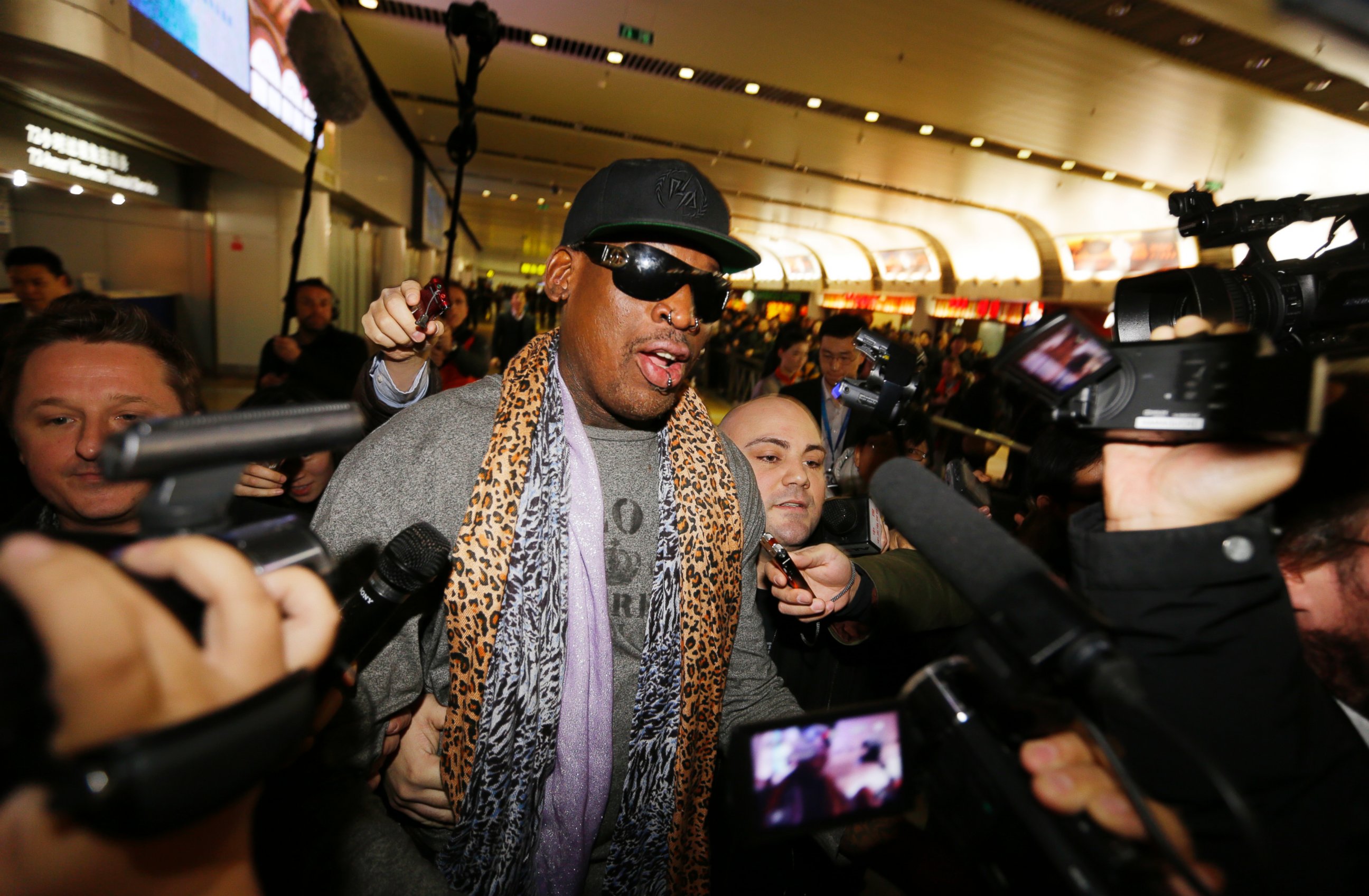 PHOTO: Former NBA basketball player Dennis Rodman speaks to the media after returning from his trip to North Korea at Beijing airport, Dec. 23, 2013.