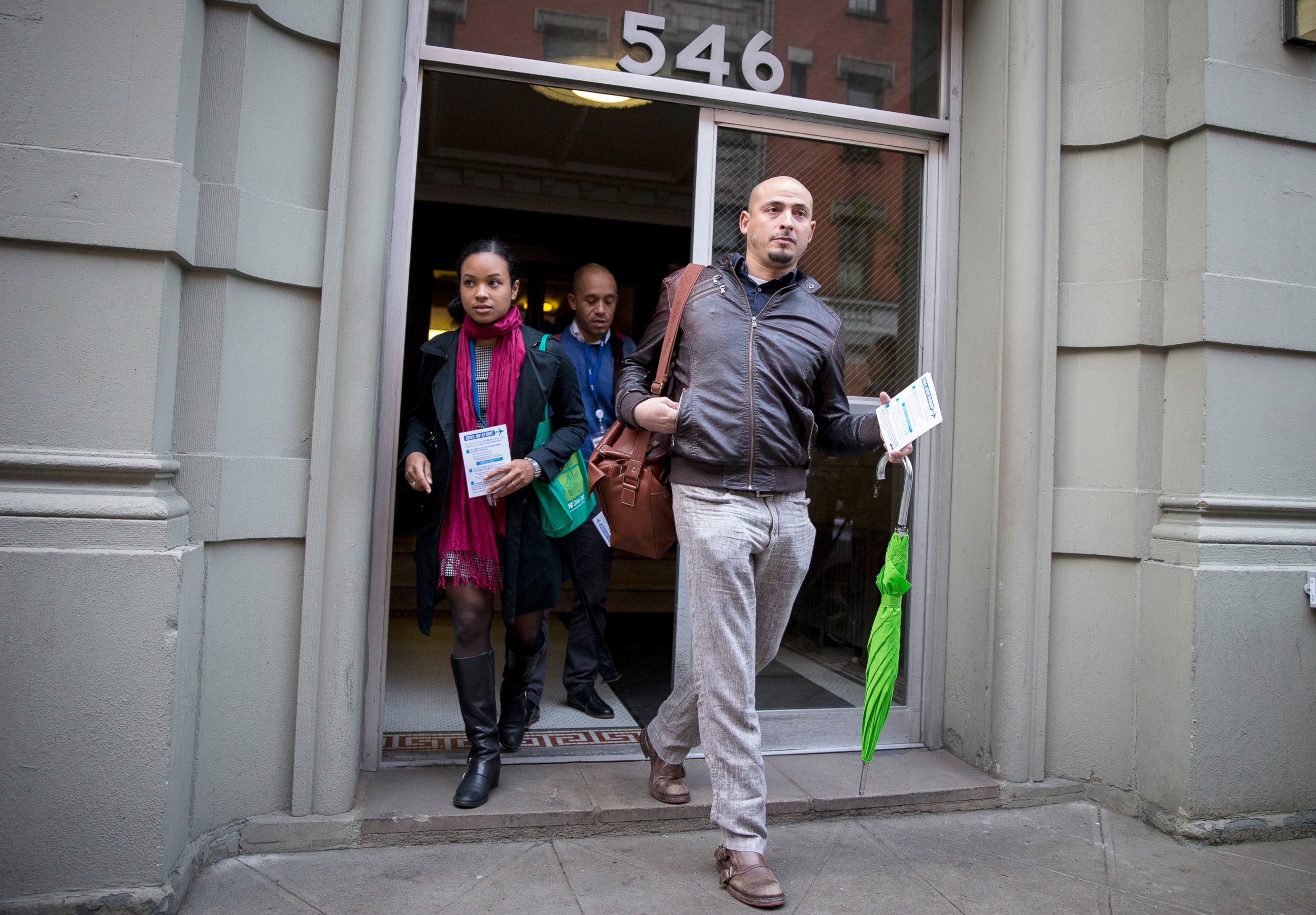 PHOTO: Members of the New York City Department of Health exit the building of a Health Care worker who is suspected  to have Ebola in in the Harlem section of New York, Oct. 23, 2014.