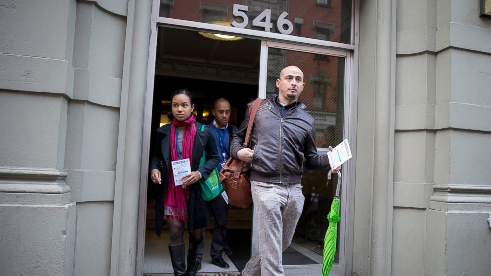 PHOTO: Members of the New York City Department of Health exit the building of a Health Care worker who is suspected  to have Ebola in in the Harlem section of New York, Oct. 23, 2014.