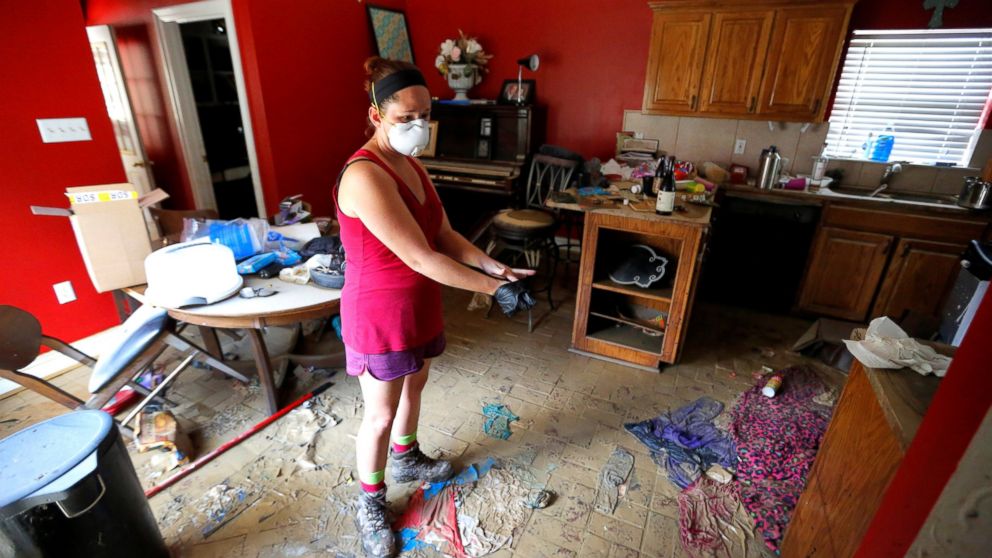 PHOTO: Johnette Folse stands in her flood damaged kitchen in Denham Springs, Louisiana, Aug. 16, 2016. 