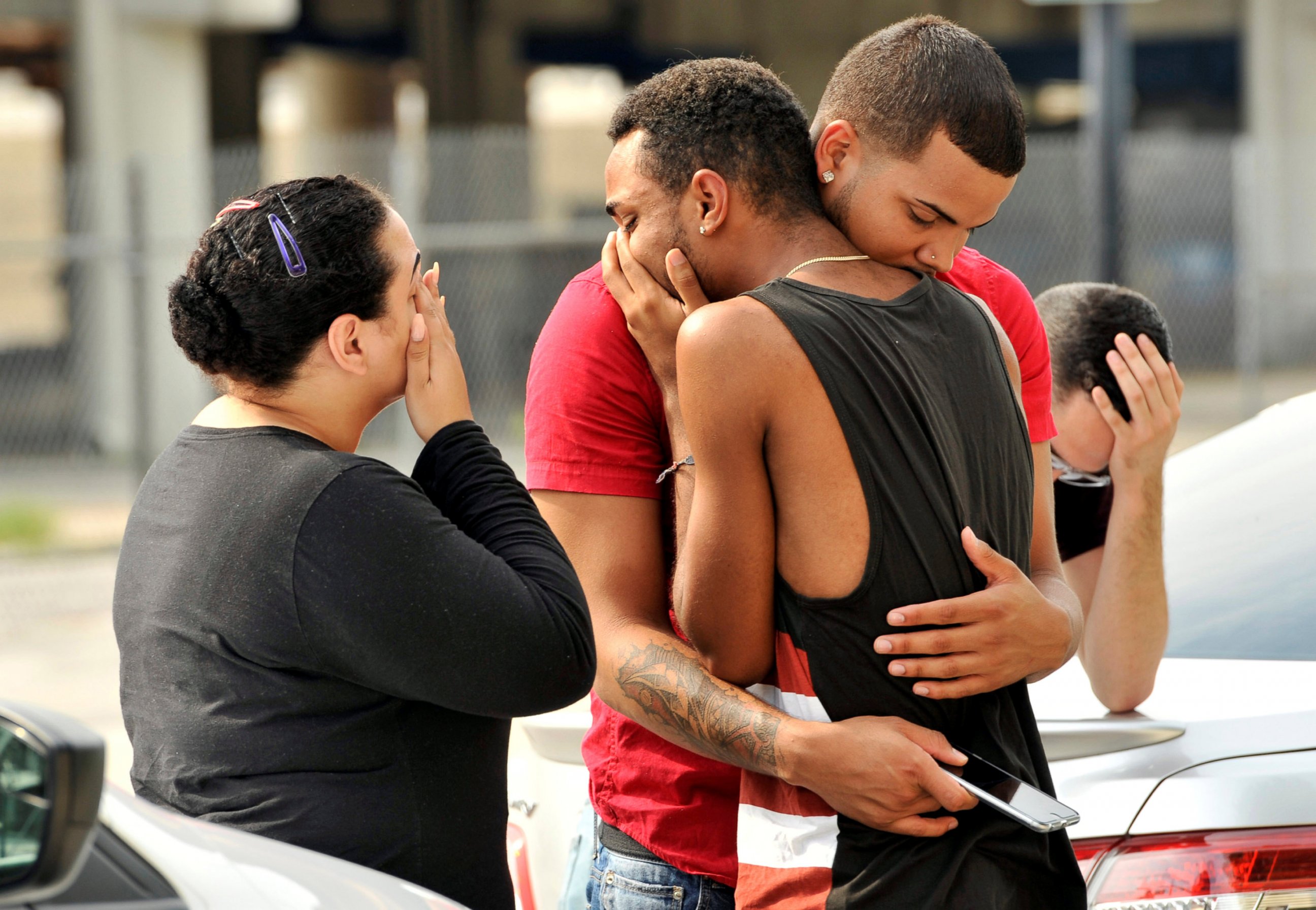 PHOTO: Friends and family members embrace outside the Orlando Police Headquarters during the investigation of a shooting at the Pulse night club, after a gunman opened fire, in Orlando, Fla., June 12, 2016.