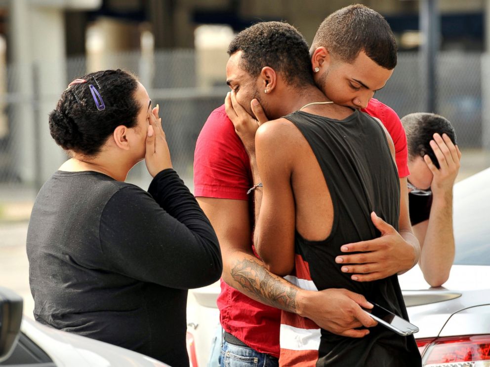 PHOTO: Friends and family members embrace outside the Orlando Police Headquarters during the investigation of a shooting at the Pulse night club, after a gunman opened fire, in Orlando, Fla., June 12, 2016.