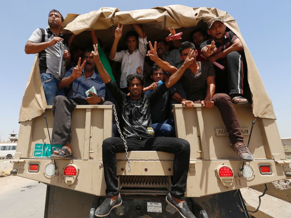 PHOTO: Volunteers, who have joined the Iraqi Army to fight against the predominantly Sunni militants who have taken over Mosul and other Northern provinces, travel in army trucks in Baghdad June 14, 2014.