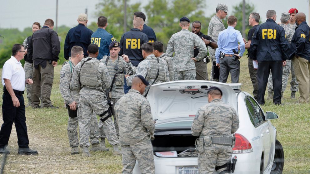 Military and law enforcement personnel are seen inside Lackland Air Force Base in San Antonio, Texas April 8, 2016.  