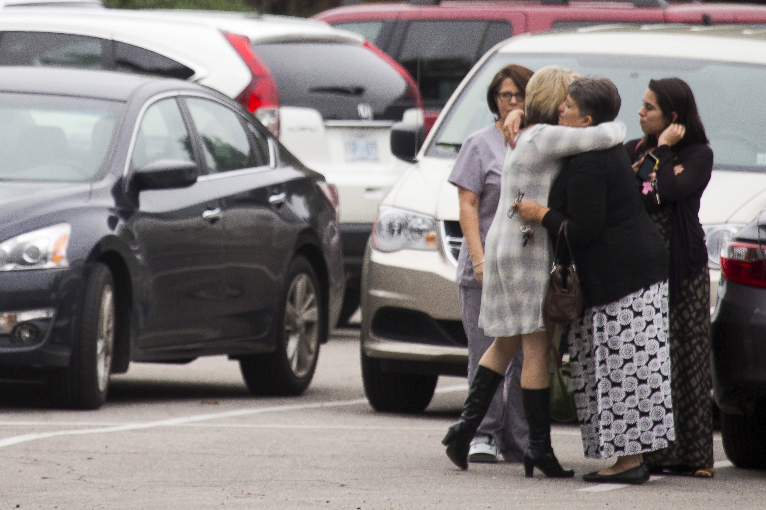 PHOTO: Mourners embrace before funeral services for six-year-old Jeremy Mardis at Moore Funeral Chapel in Hattiesburg, Mississippi, Nov. 9, 2015. 