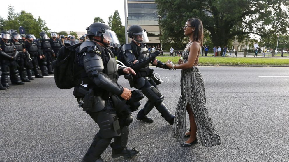 A demonstrator protesting the shooting death of Alton Sterling is detained by law enforcement near the headquarters of the Baton Rouge Police Department in Baton Rouge, Louisiana, July 9, 2016.
