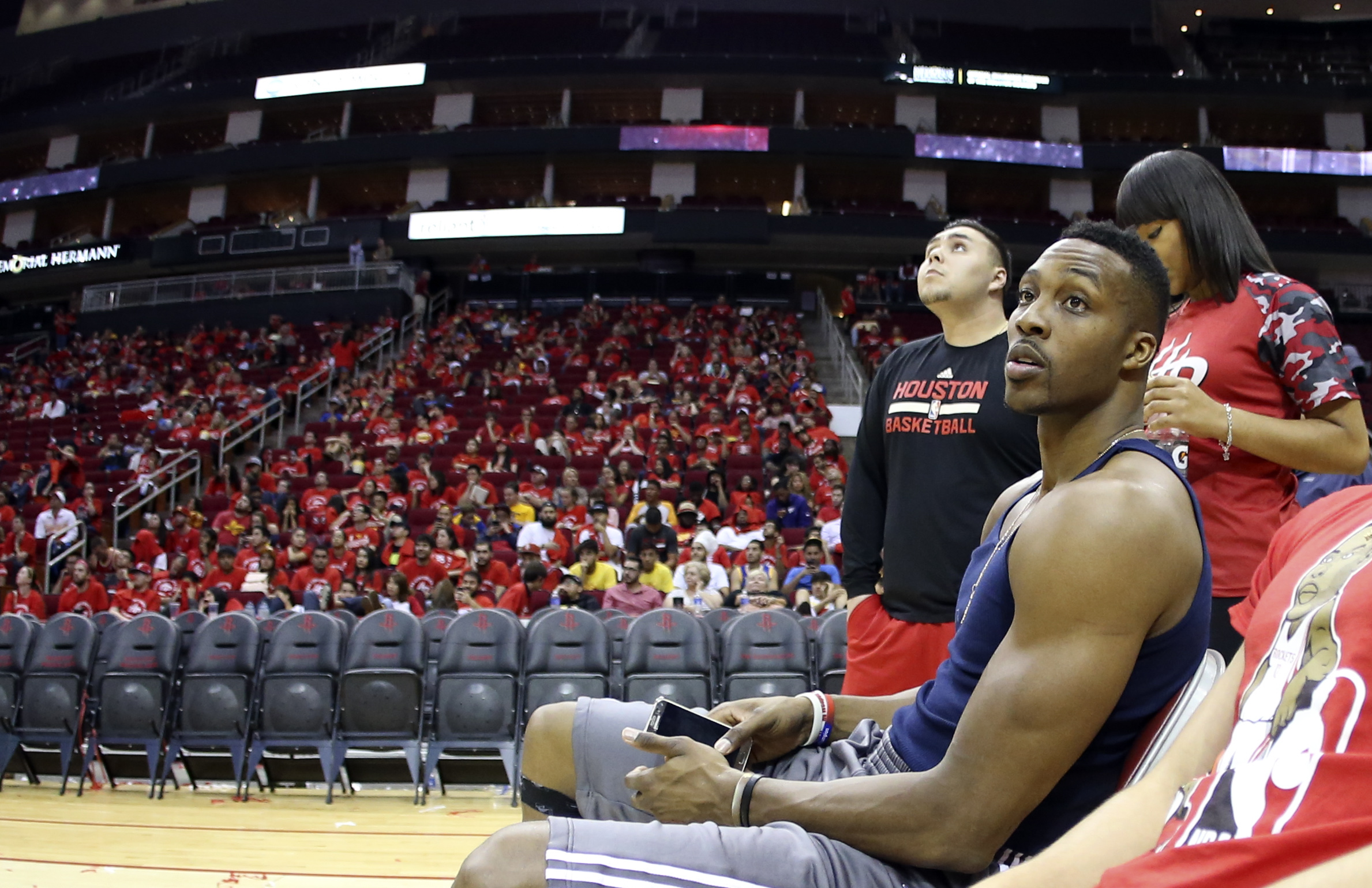 PHOTO: Houston Rockets center Dwight Howard waits with fans in the arena due to emergency flash flooding