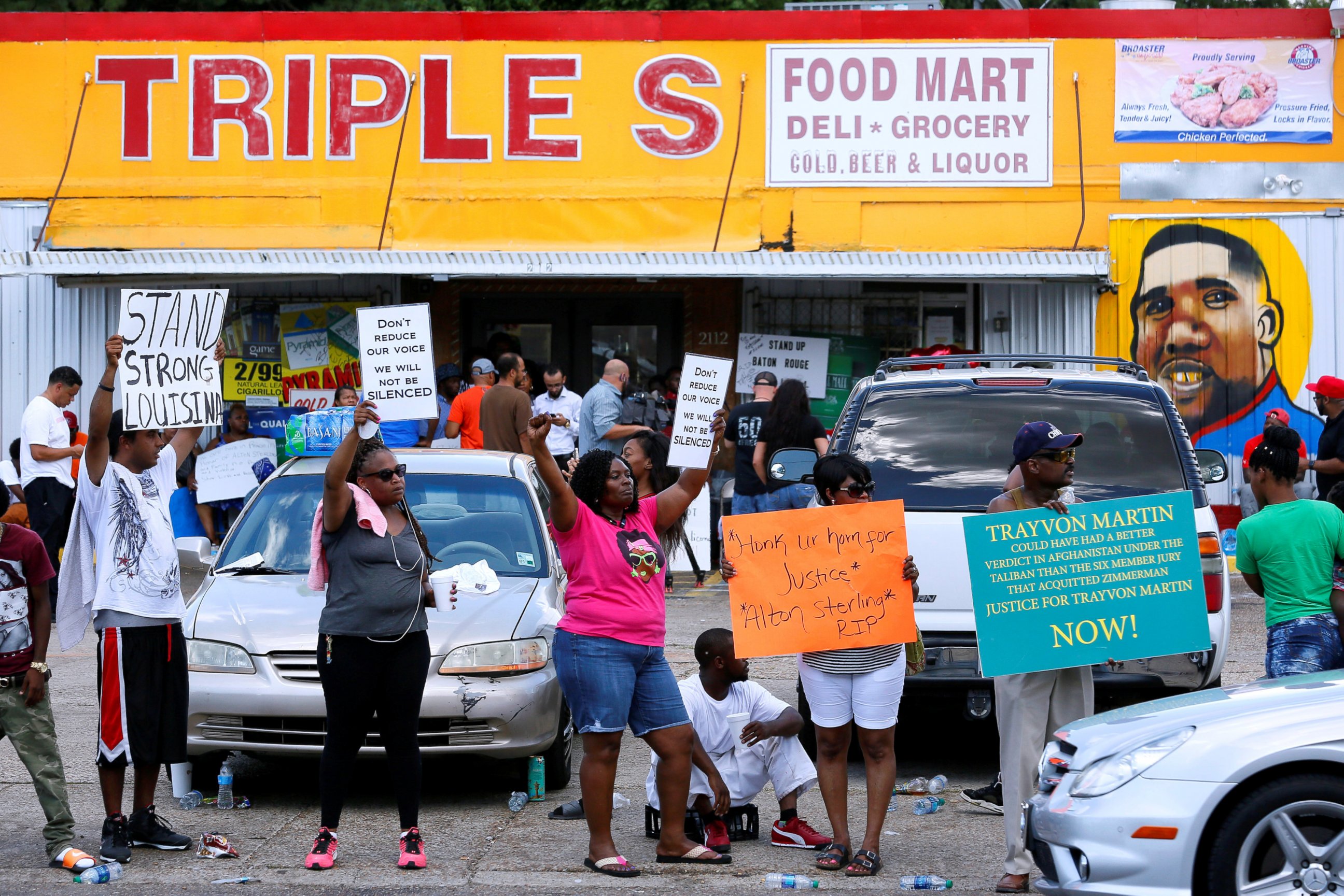 PHOTO: Protesters demonstrate outside the Triple S Food Mart where Alton Sterling was shot dead by police in Baton Rouge, Louisiana, July 7, 2016.