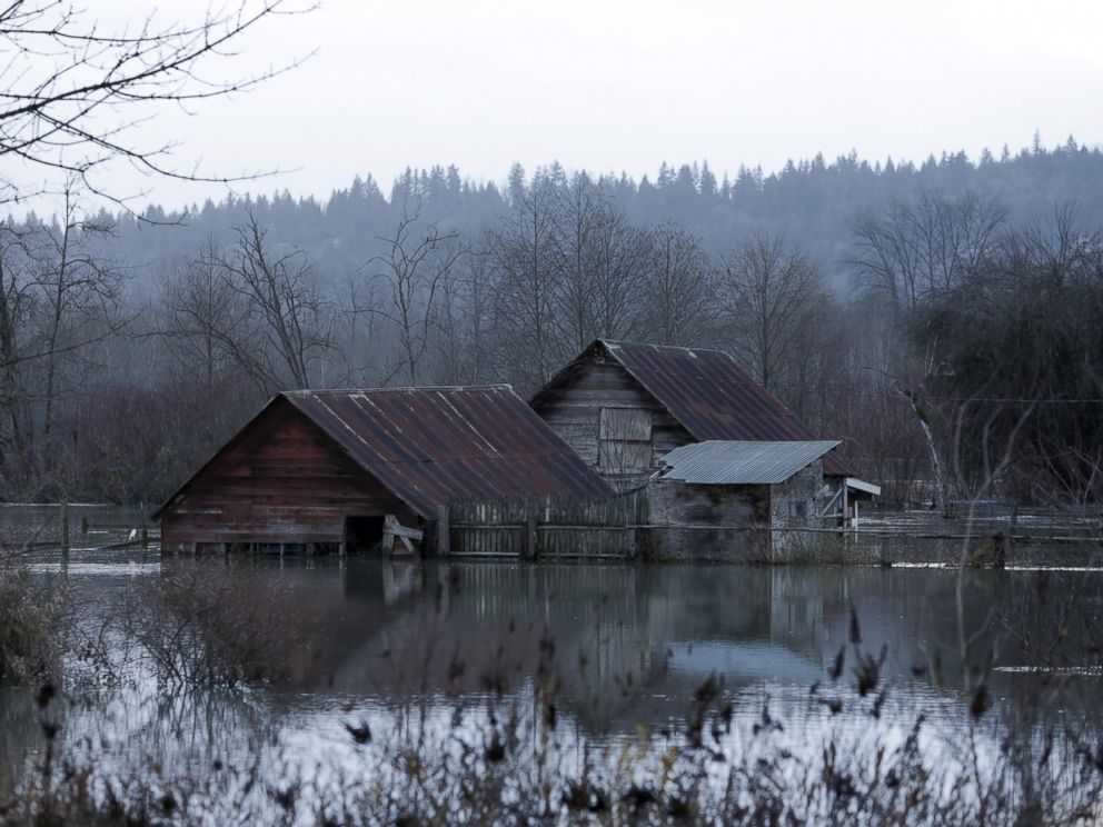 PHOTO:Flood waters of the Snoqualmie River surround a structure off State Route 203 during a storm in Carnation, Wash., Dec. 9, 2015.