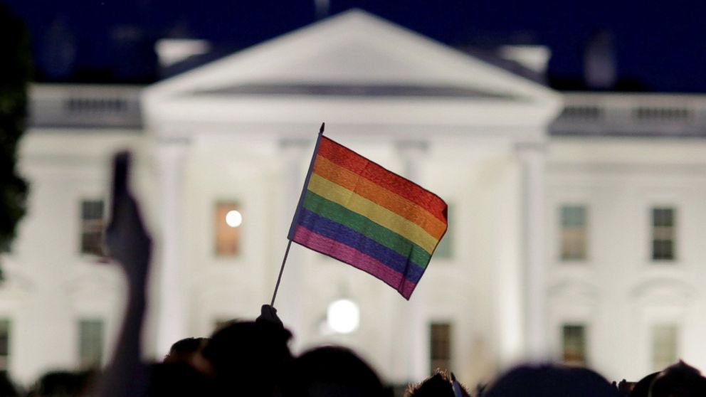 PHOTO: A rainbow flag is held up during a vigil after the worst mass shooting in U.S. history at a gay nightclub in Orlando, in front of the White House in Washington, June 12, 2016.