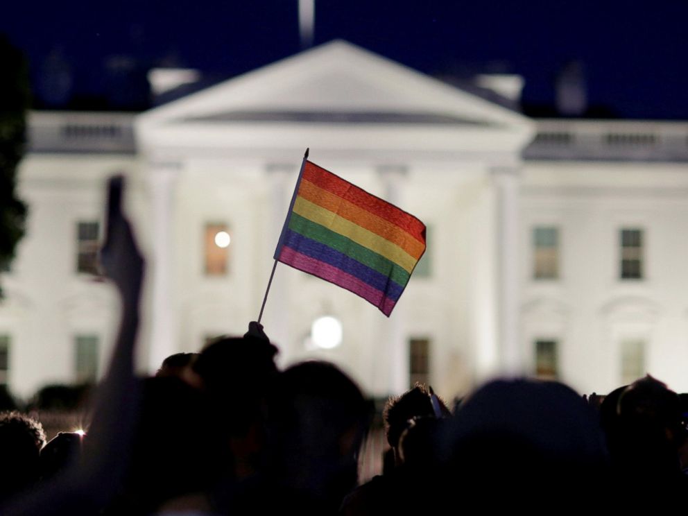 PHOTO: A rainbow flag is held up during a vigil after the worst mass shooting in U.S. history at a gay nightclub in Orlando, in front of the White House in Washington, June 12, 2016.