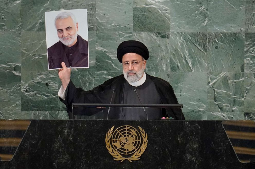 PHOTO: President of Iran Ebrahim Raisi holds up a photo of slain Iranian Gen. Qassem Soleimani as he addresses the 77th session of the United Nations General Assembly, Wednesday, Sept. 21, 2022 at U.N. headquarters. 