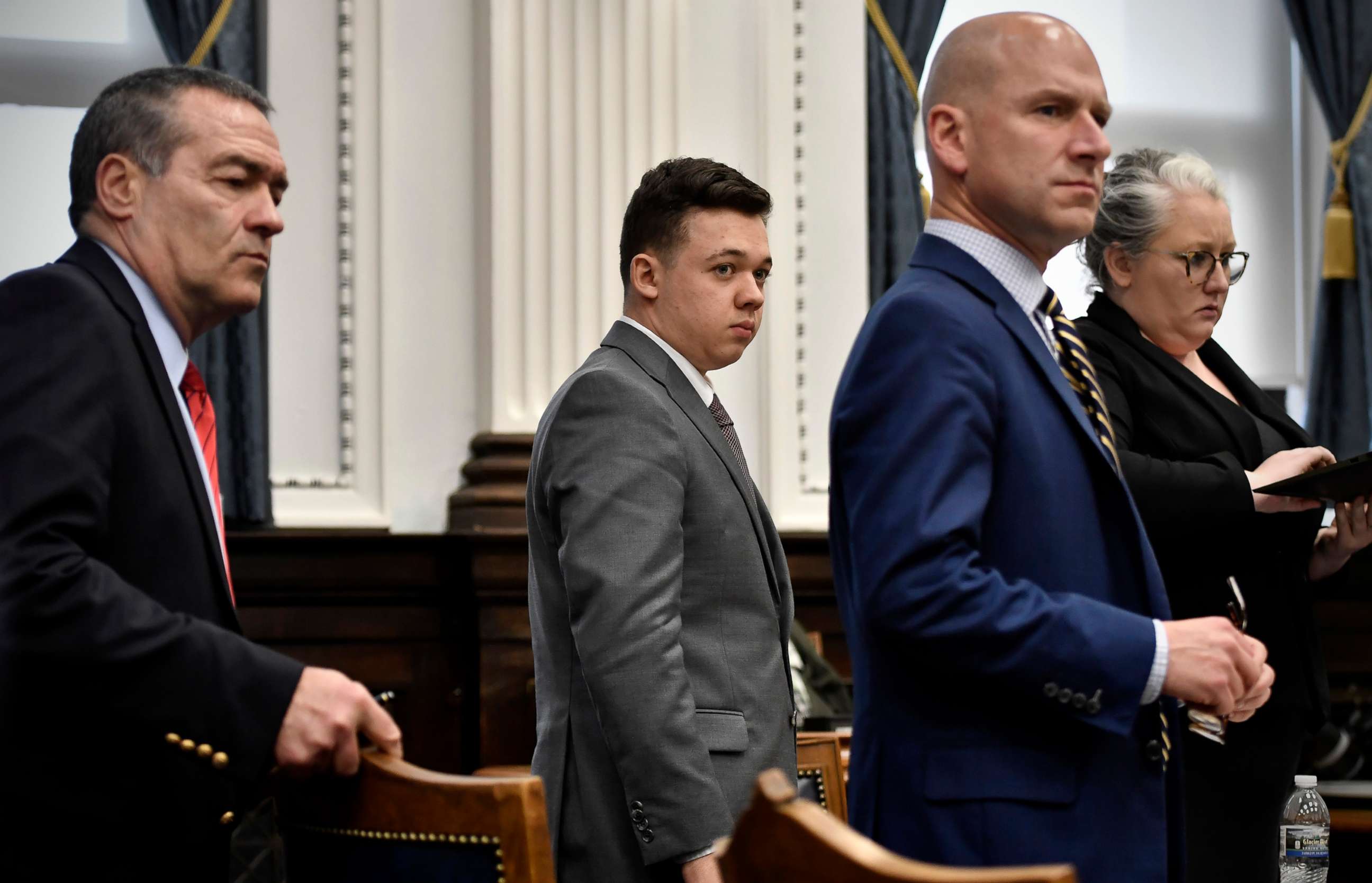PHOTO: Kyle Rittenhouse, center, stands with his attorneys, from left, Mark Richards, Corey Chirafisi and Natalie Wisco before viewing video during proceedings at the Kenosha County Courthouse in Kenosha, Wis., Nov. 12, 2021. 