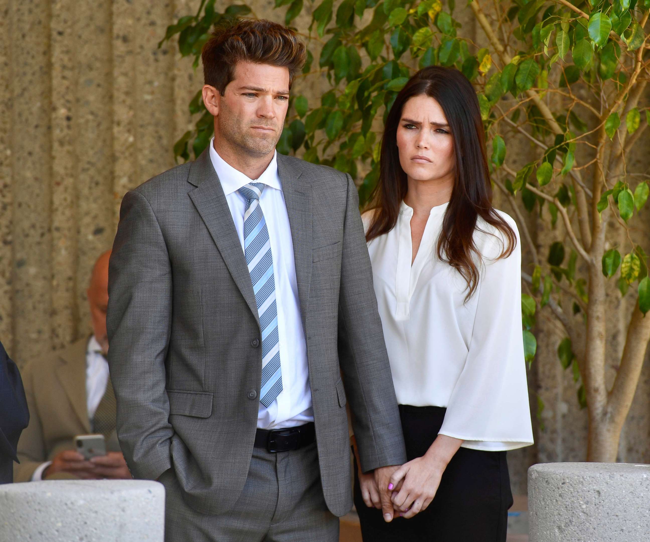 PHOTO: Dr. Grant Robicheaux and his girlfriend Cerissa Riley listen during a news conference by their lawyer Philip Kent Cohen in Newport Beach, Calif., Oct. 17, 2018.