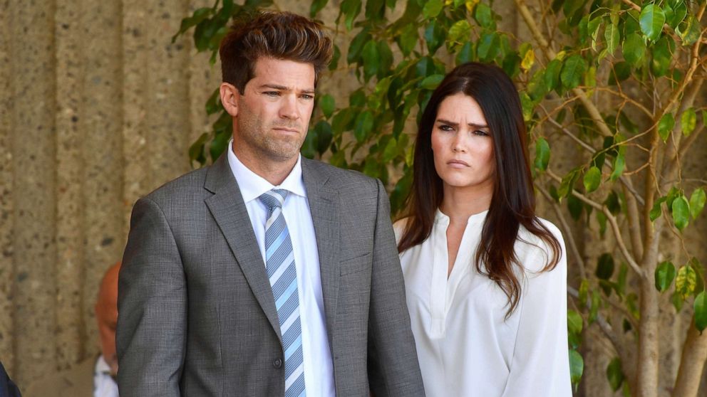 PHOTO: Dr. Grant Robicheaux and his girlfriend Cerissa Riley listen during a news conference by their lawyer Philip Kent Cohen in Newport Beach, Calif., Oct. 17, 2018.