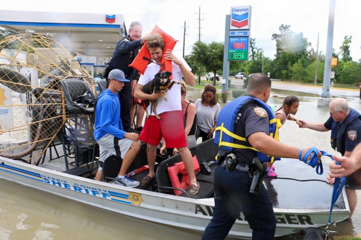PHOTO: Harris County Sheriff deputies help residents evacuate from high water in the Wimbledon Champions subdivision of Houston, Texas,  April 20, 2016. 