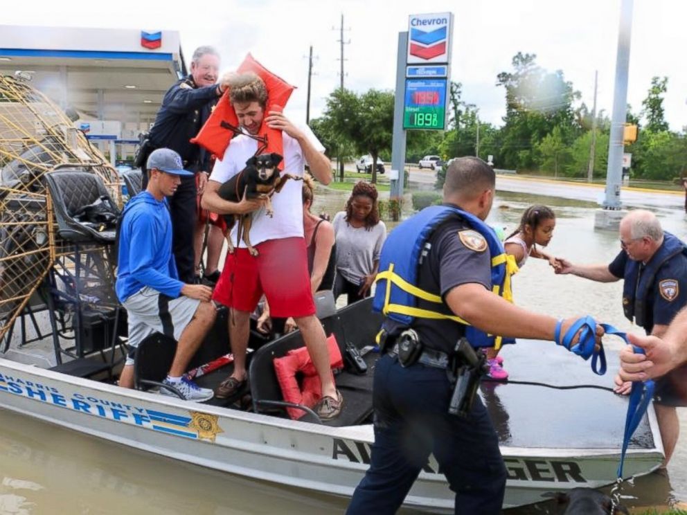 PHOTO: Harris County Sheriff deputies help residents evacuate from high water in the Wimbledon Champions subdivision of Houston, Texas, April 20, 2016.