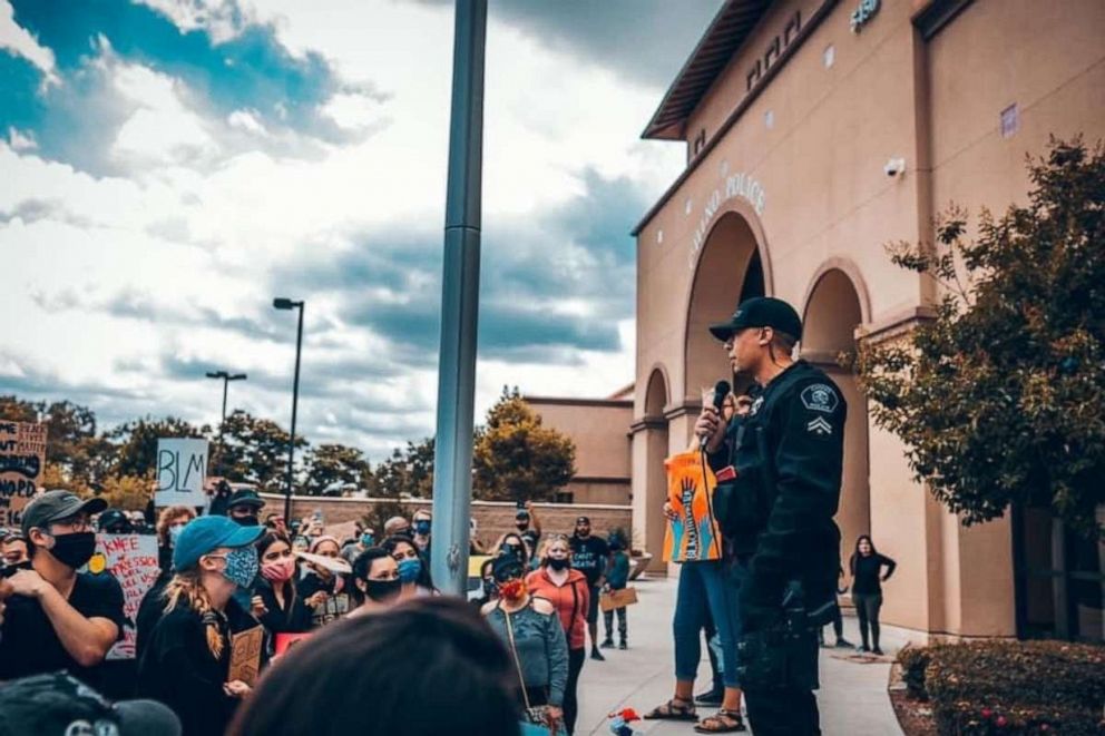 PHOTO: Ryan Tillman speaks with protesters who gathered outside the Chino Police Department, in Chino, California amid widespread outrage over the police the killing of George Floyd.
