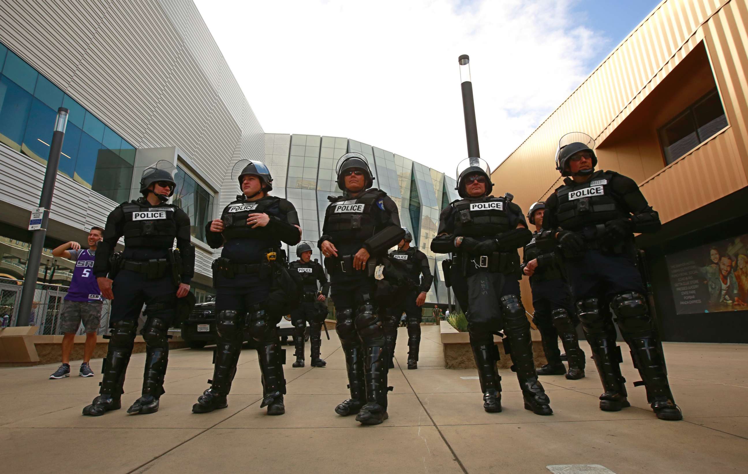 PHOTO: Sacramento Police officers stand near the entrance to the Golden 1 Center, March 29, 2018, in Sacramento, Calif. 