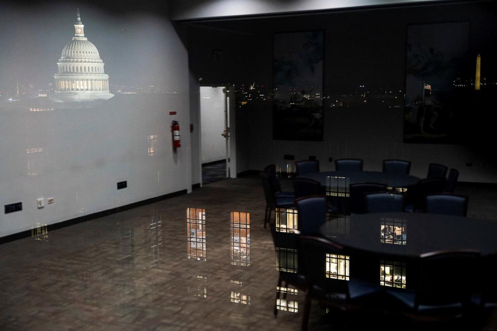 PHOTO: The Capitol and an office are reflected in a window inside the Hart Senate Office Building on Capitol Hill in Washington, D.C., on July 1, 2025.