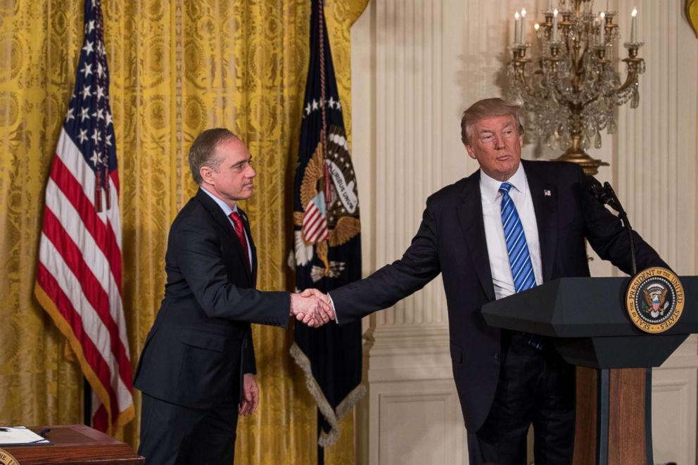 PHOTO: VA Secretary David Shulkin, and President Donald Trump shake hands, before President Trump signs the Department of Veterans Affairs Accountability and Whistleblower Protection Act of 2017 in the East Room of the White House, on June 23, 2017.