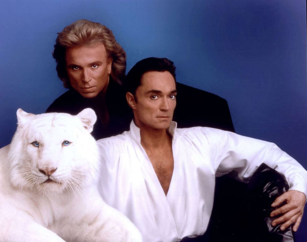 PHOTO:Siegfried & Roy pose with a white tiger in this undated photo. 