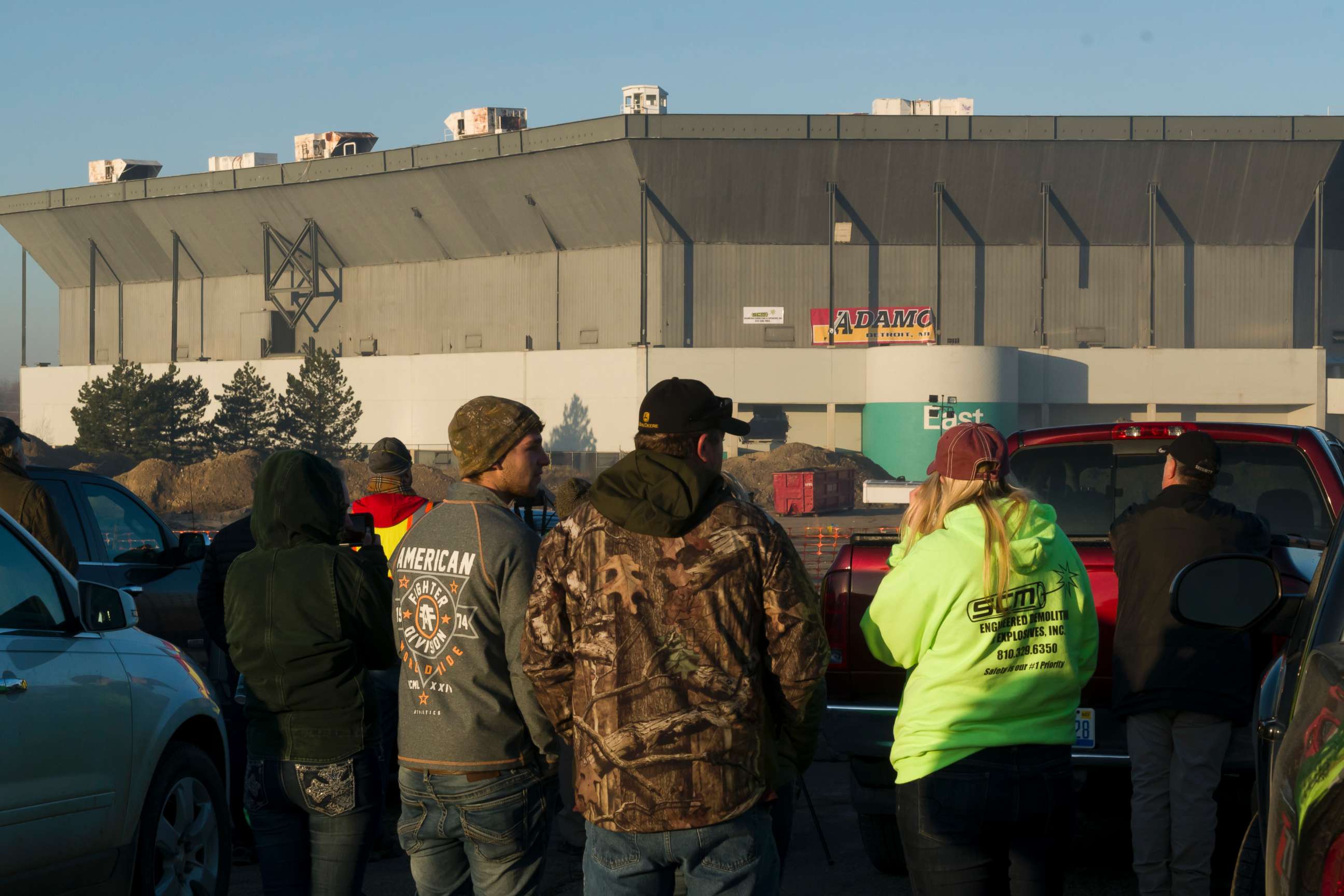 PHOTO: People stand and stare after an attempt a a partial collapse of the Silverdome, in Pontiac, Mich., Dec. 3, 2017. Technical problems with the explosives left the stadium still standing after the blast. 