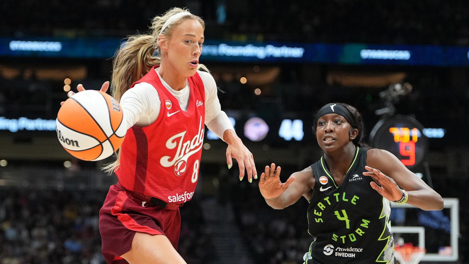 PHOTO: Sophie Cunningham of the Indiana Fever handles the ball against Flau'jae Johnson of the Seattle Storm during their WNBA game, July 28, 2026 in Seattle.