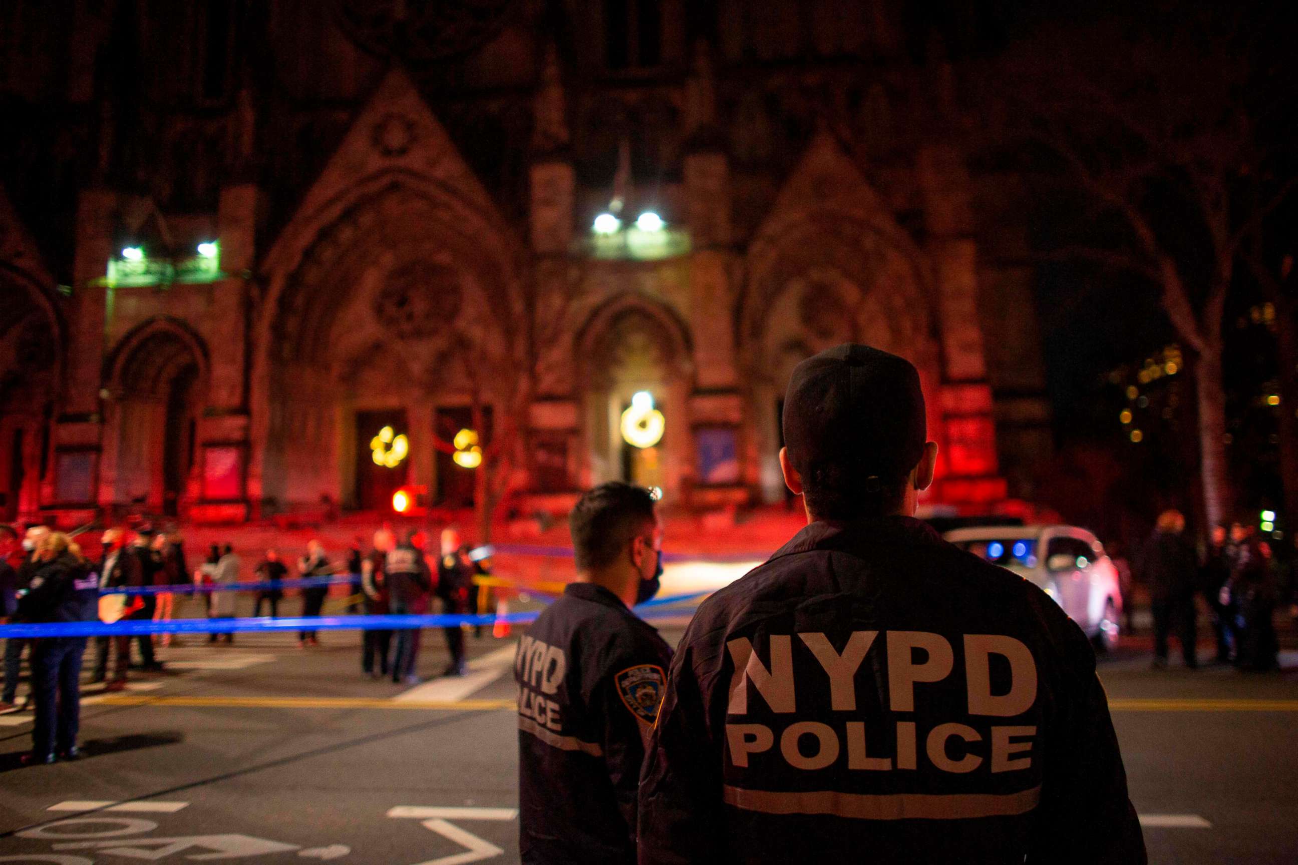 PHOTO: Police officers stand guard outside of the Cathedral of St. John the Divine in New York on December 13, 2020, after a shooter opened fire outside the church. 