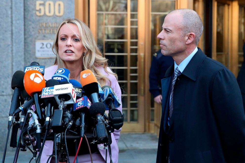 PHOTO: Stormy Daniels, accompanied by her attorney, Michael Avenatti, talks to the media as she leaves federal court, April 16, 2018, in New York. 