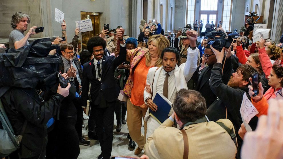 PHOTO: Tennessee State Representative Justin Pearson, Gloria Johnson and Justin Jones hold hands as they walk in the State House in Nashville, Tenn., April 6, 2023.