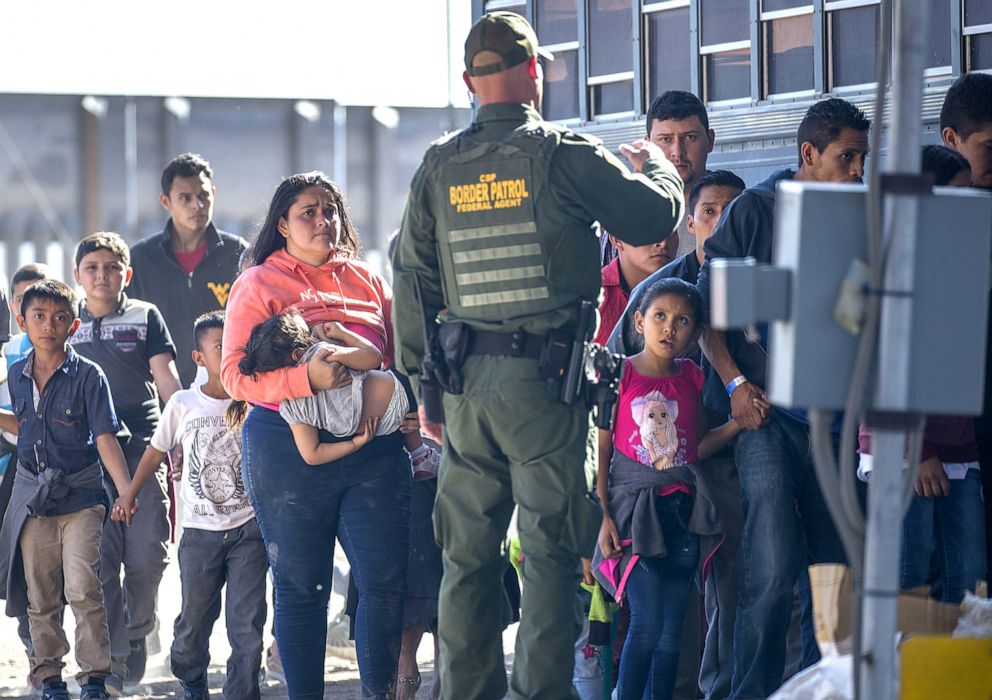 PHOTO: Detained migrants are loaded onto a bus by Border Patrol agents after crossing into the United States from Mexico, June 1, 2019, in El Paso, Texas. 