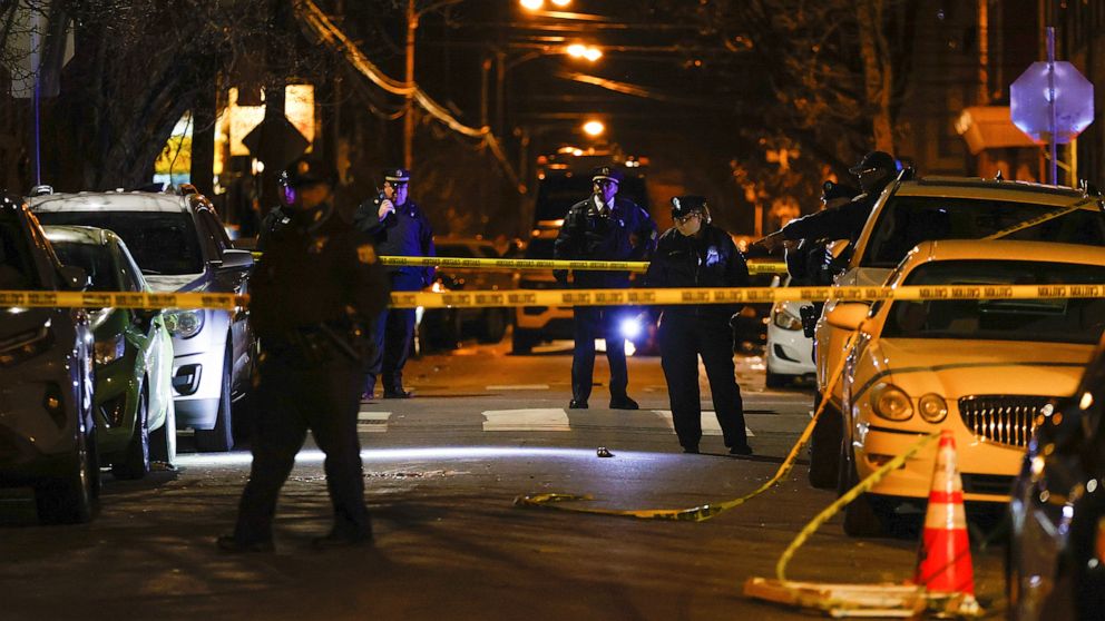 PHOTO: Philadelphia police officers investigate the fatal shooting of a Temple University police officer near the campus on Saturday, Feb. 18, 2023, in Philadelphia. (Yong Kim/The Philadelphia Inquirer via AP)